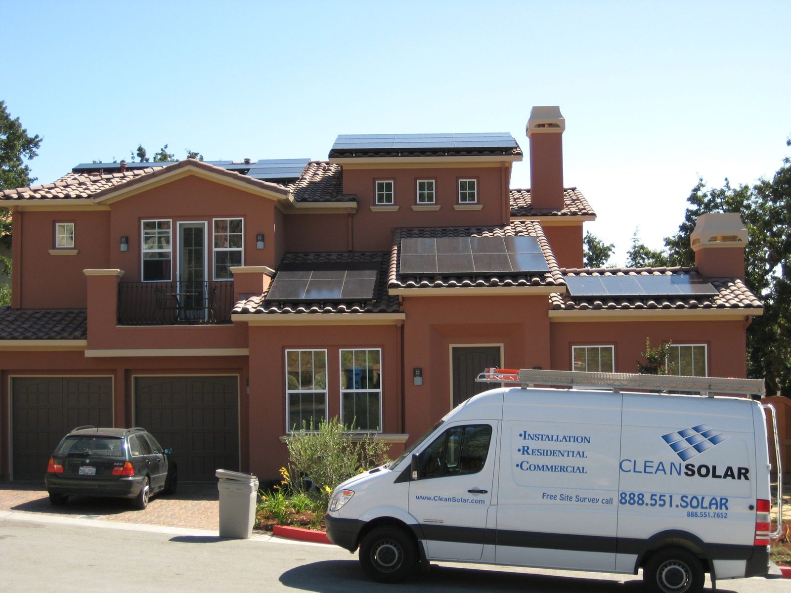 Clean Solar Team Installing Panels On A Home Roof