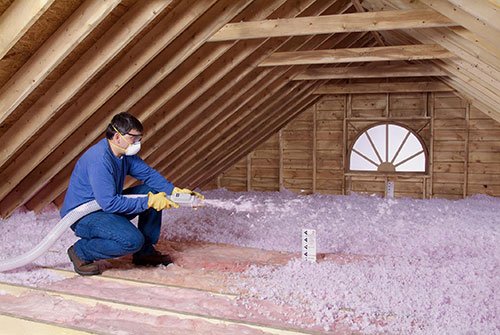 Attic Insulation Installed To Improve Energy Efficiency